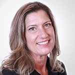 A woman in a black shirt smiling for the camera.