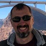 A man holding a dog.